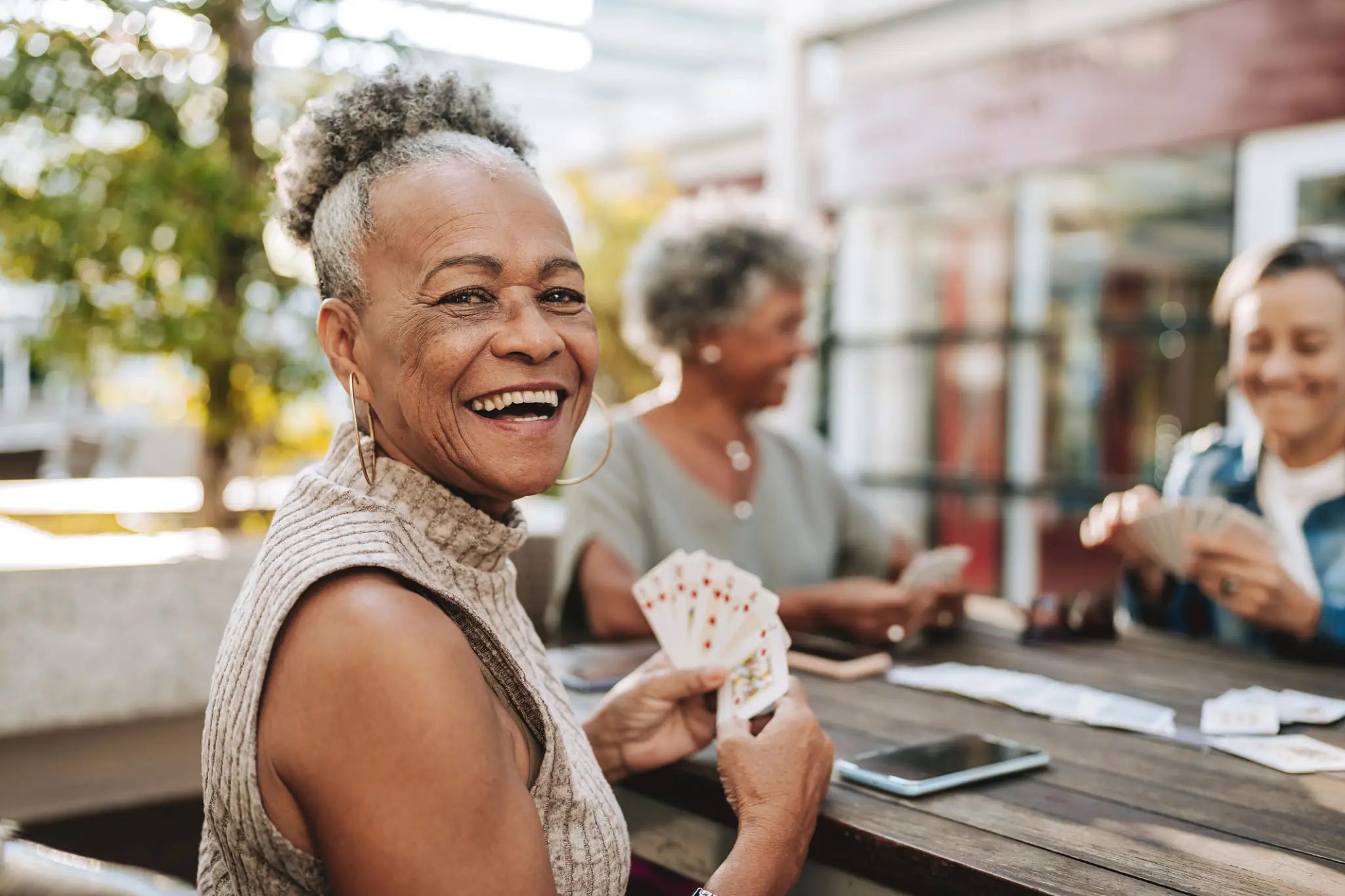 Senior friends playing cards